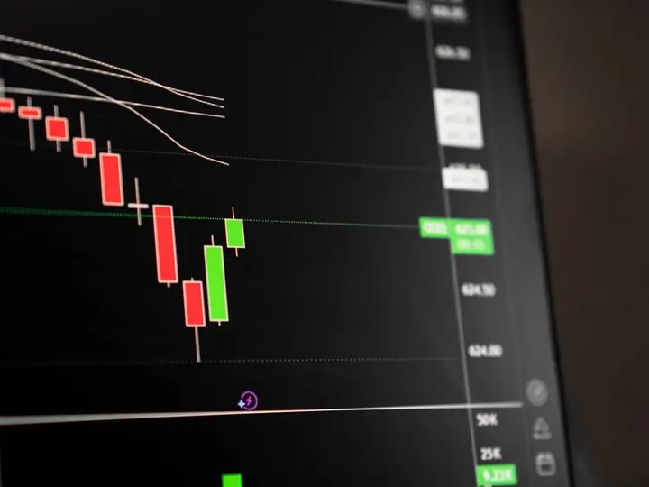 Candlestick chart showing a downward trend in the stock market analysis.